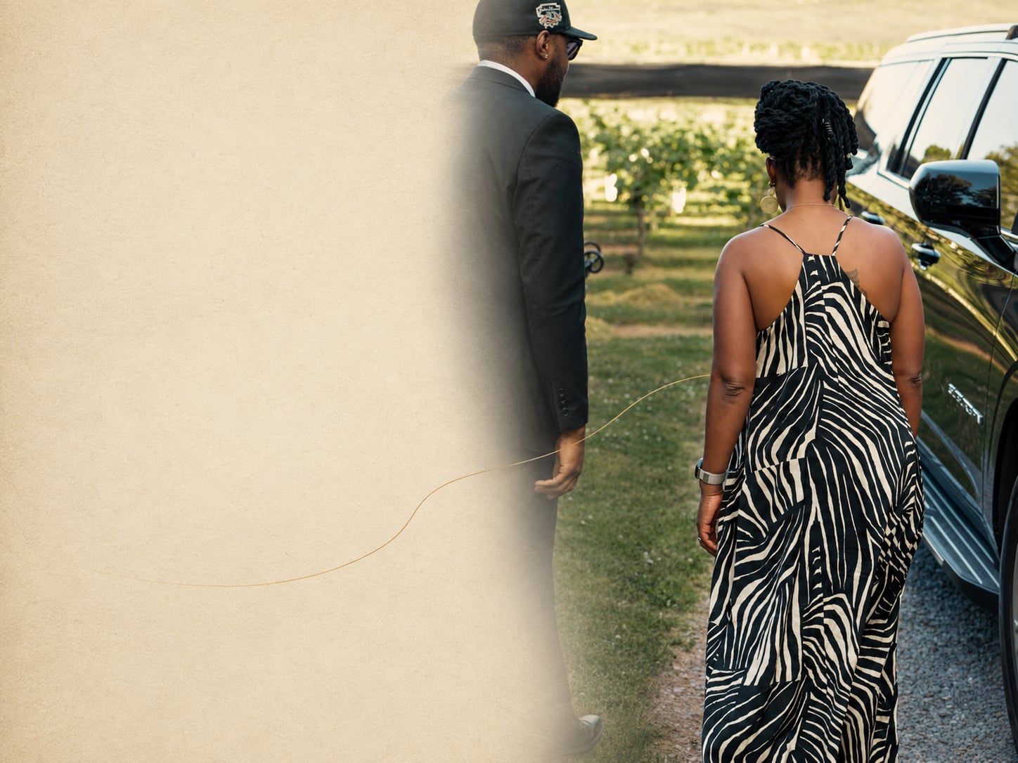 Clients walking to the Suburban at a Virginia vineyard at golden hour